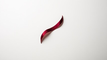Obraz premium A modern-style red ribbon with a curved badge and label, set against a white background.