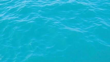 Obraz premium Blue water wave texture resembling a calm and serene ocean surface, aqua, motion, surface