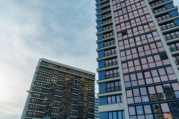 Fototapeta premium Modern skyscrapers in the new area. Tall buildings made of glass against the sky. Buying or renting luxury real estate. Moscow City