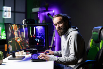 Smiling professional player competing in videogame tournaments online while streaming on internet channels for viewers. Joyful pro gamer participating in esports competition during stream with fans