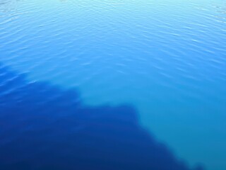 Ripples creating patterns on a crystal clear water surface, nature, surface