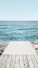  a minimalist ocean shore with simple lines and soft colors,