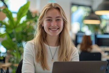 Happy female programmer in office  satisfied with achievements.