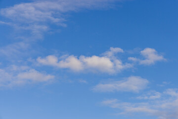 Bright Blue Sky with Fluffy White Clouds on a Sunny Day