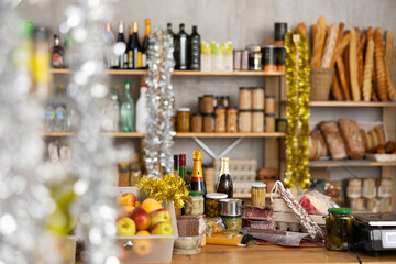 Buying food for Christmas dinner. Champagne with snacks, cheese, sausage on the counter in supermarket. Set of quality products for the New Year