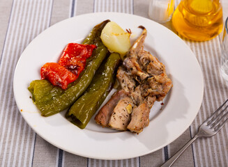 Tender rabbit meat with baked beans and bell peppers