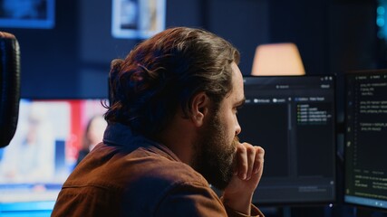 Developer overthinking solutions while doing programming during remote job shift in home office. IT...