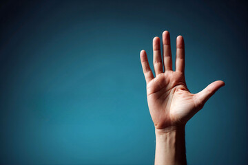 Hand raised against a blue background to signal greeting or inquiry