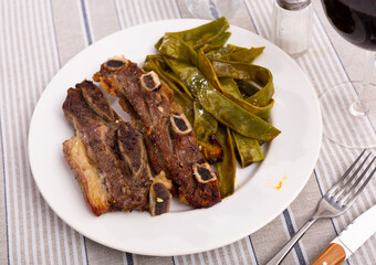 Appetizing roasted beef served with green beans on platter