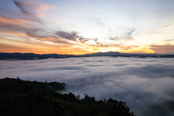 Amazing Sunrise or sunset over mountains hills covered with mist, Aerial view landscape drone shot beautiful colorful nature background