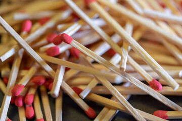 Several red-headed phosphor sticks arranged inside the box