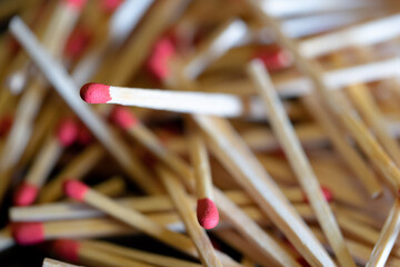 Cluttered and disorganized set of red-headed phosphor sticks
