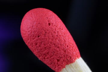 Macrophotography of phosphorus head made of flammable red material