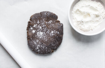 Overhead view of molasses cookie dough on a white countertop, top view of gingerbread cookie dough, process of making christmas cookies