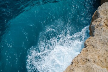 The water is blue and has white foam