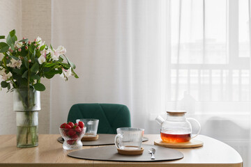 A Cozy Breakfast Setting Featuring Tea and an Array of Fresh, Juicy Berries Ready to be Enjoyed