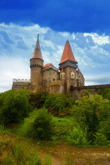 Fototapeta premium Impressive landscape with medieval Corvin Castle on elevated rock, Hunedoara, Romania