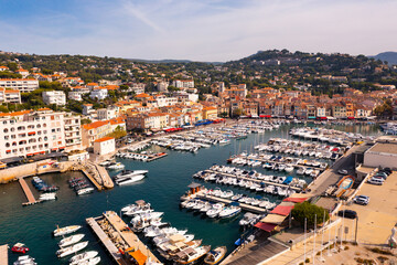 Fototapeta premium Picturesque aerial view of Cassis cityscape on Mediterranean coast with marina on sunny autumn day, Southern France.