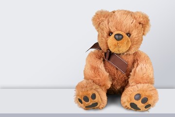 Cute toy Teddy bear on background