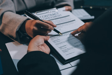 Close up Business people or Real Estate agent explain signing agreement for sale house to client. Property, Insurance, Broker concept.