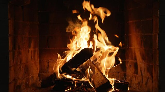 Burning Fireplace Providing Warmth and Comfort. Flames Dancing and Creating a Warm Glow in a Cozy Fireplace, Perfect for a Winter Evening, Christmas or New Year's Eve Celebration