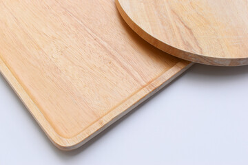 brown wooden tray and sphere cuttingboard isolated on white background