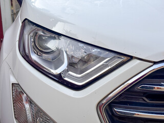 The headlight of a car is very shiny and clean © njbfoto