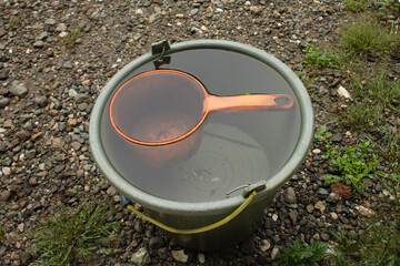 ladle and water in the bucket © budiono