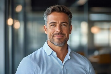 Obraz premium Confident Middle Aged Businessman Portrait in Modern Office Environment