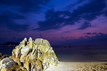 Kalim Beach with rock at twilight time sky in summer Phuket Thailand