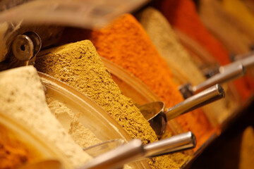 Experience the Vibrant Spices Displayed in Colorful Baskets at the Local Market Today