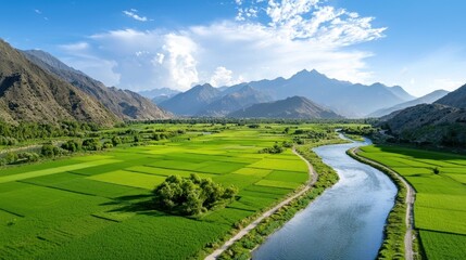 Breathtaking panoramic view of a serene countryside landscape with lush green fields majestic mountains and a winding river flowing through the picturesque valley