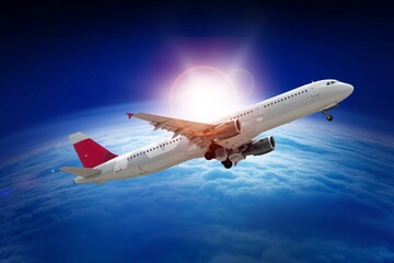 Naklejka premium Airplane at flight, travel background with blue sky