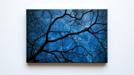 A dark blue artwork featuring intricate branches, creating a striking contrast and evoking a sense of depth and nature.