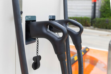 Electric car charging station. Hybrid car Electric charger station in the Car Park. Electric car charging on parking and charging station.