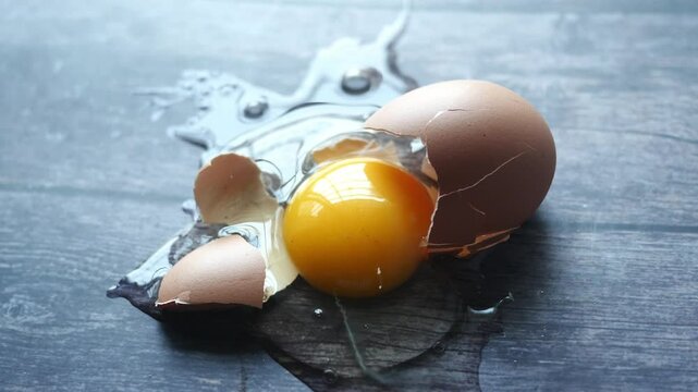 Fresh broken egg in kitchen floor