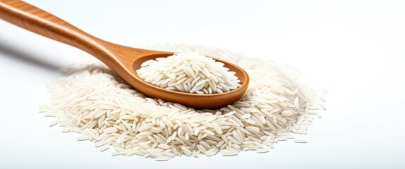 A wooden spoon filled with uncooked white rice, next to a large mound of rice, on a white background. The image is bright and well-lit, with a clean and minimalistic aesthetic. The rice is fluffy and 