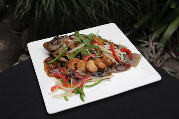 fish gurami with tauco sauce and tofu black beans chinese food white square plate