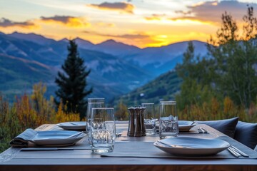 Fototapeta premium Outdoor table set for dinner, mountain sunset view.
