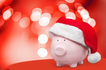 Piggy bank in Christmas santa hat