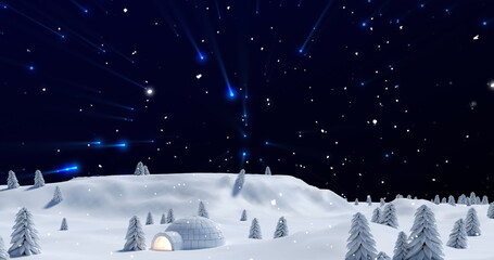 Image of blue lights and christmas snow falling in night sky over winter landscape with igloo