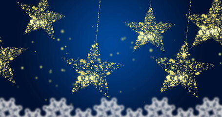Fototapeta premium Image of gold christmas stars swinging over snowflakes and blue background