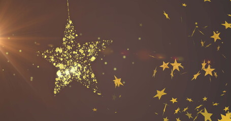 Naklejka premium Image of gold christmas star bauble swinging and floating gold stars on dark background
