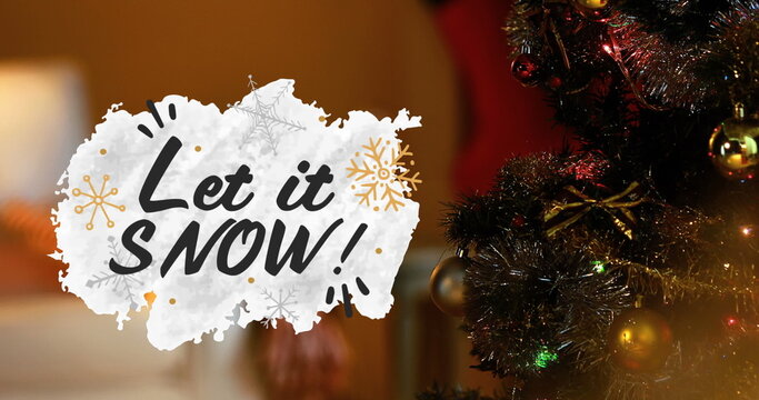 Image of let it snow text over christmas tree