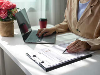 Businesswoman employer holding resume, recruiting, planning, evaluating and reviewing resume of job...