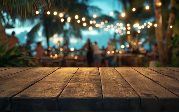 Empty wooden table at night beach party.