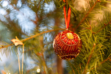 red christmas ball on a tree
