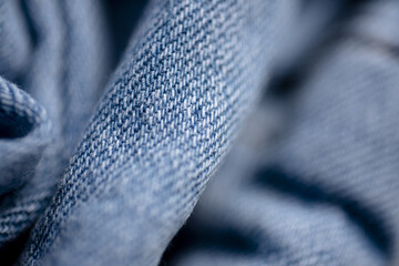Jeans macro. Jeans texture or denim background. Denim fabric. Jeans fabric texture. Jean trousers pants. Blue denim cloth. Denim texture for background design. Jeans texture.