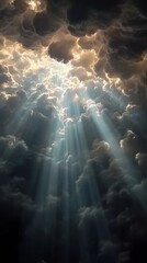 Fototapeta premium Sunbeams through dramatic clouds, atmospheric sky