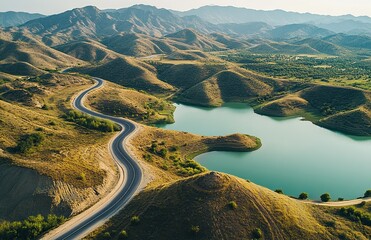 Aerial view of the winding roads and lakes, colorful mountains on both sides